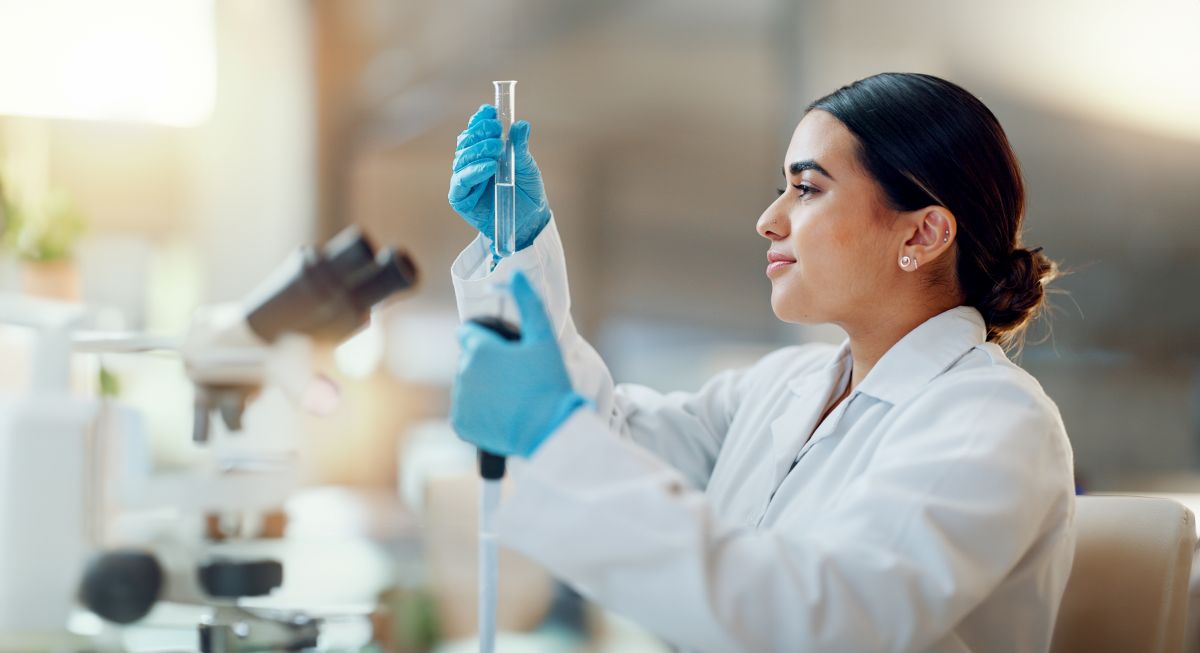 Technician looking at a test tube