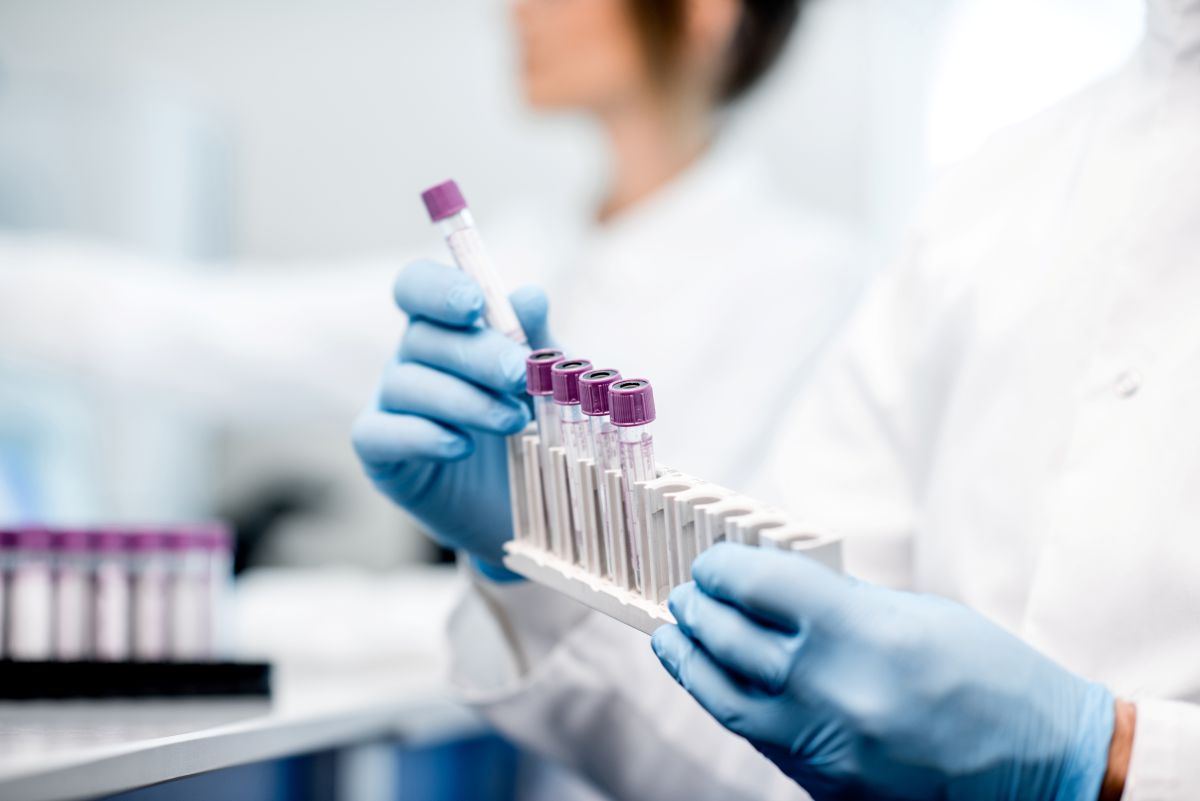 Technician lining up test tube samples